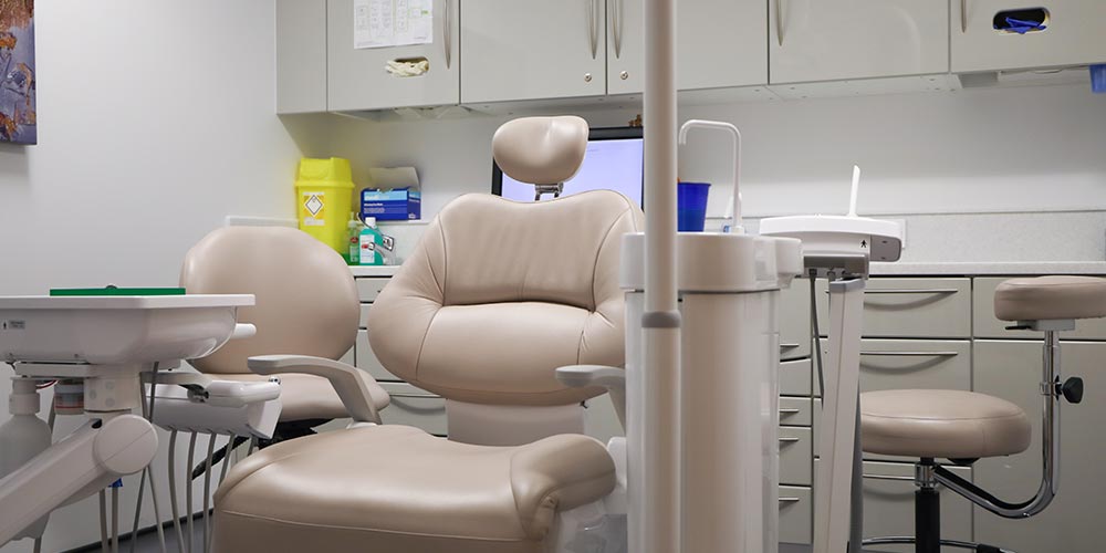 beige dental chair in clean treatment room